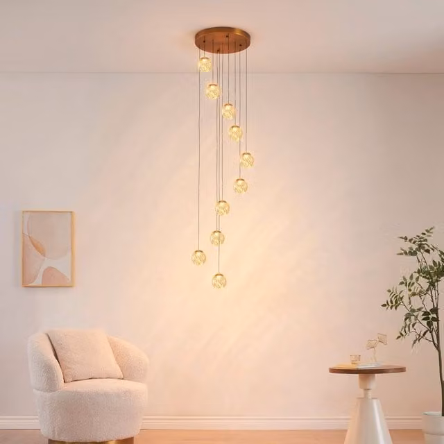 Lámpara colgante LED moderna KOSILUM de esferas en cristal y metal color dorado para escalera y pasillo con altura ajustable de 3 m